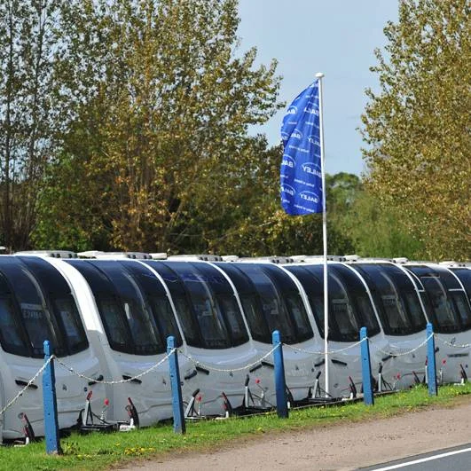 A line-up of Bailey of Bristol caravans on the Farnham Leisure caravan dealership lot.