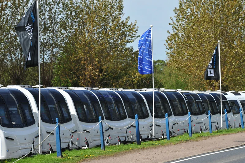 A line-up of Bailey of Bristol caravans on the Farnham Leisure caravan dealership lot.
